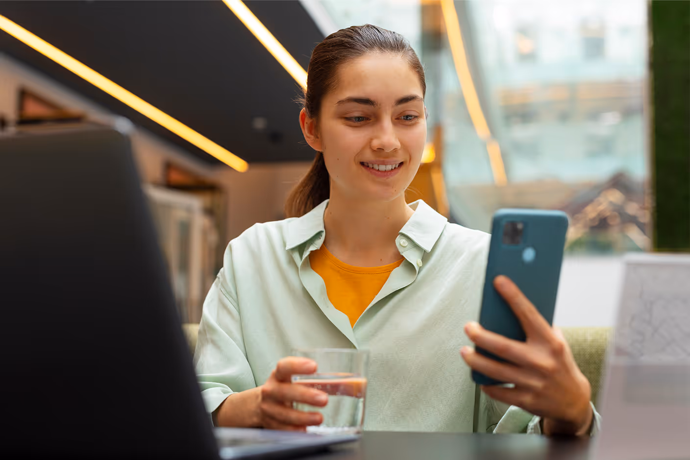 Team member using a mobile phone to manage inventory tasks